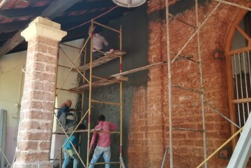 Plastering the church walls